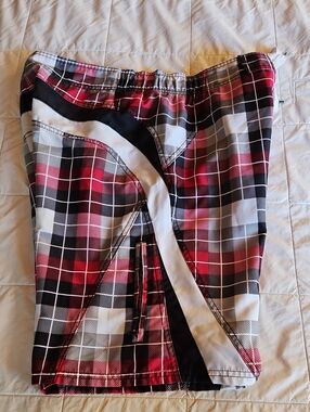 JOE BOXER board shorts w/ a red, black, and white plaid pattern with solid - M